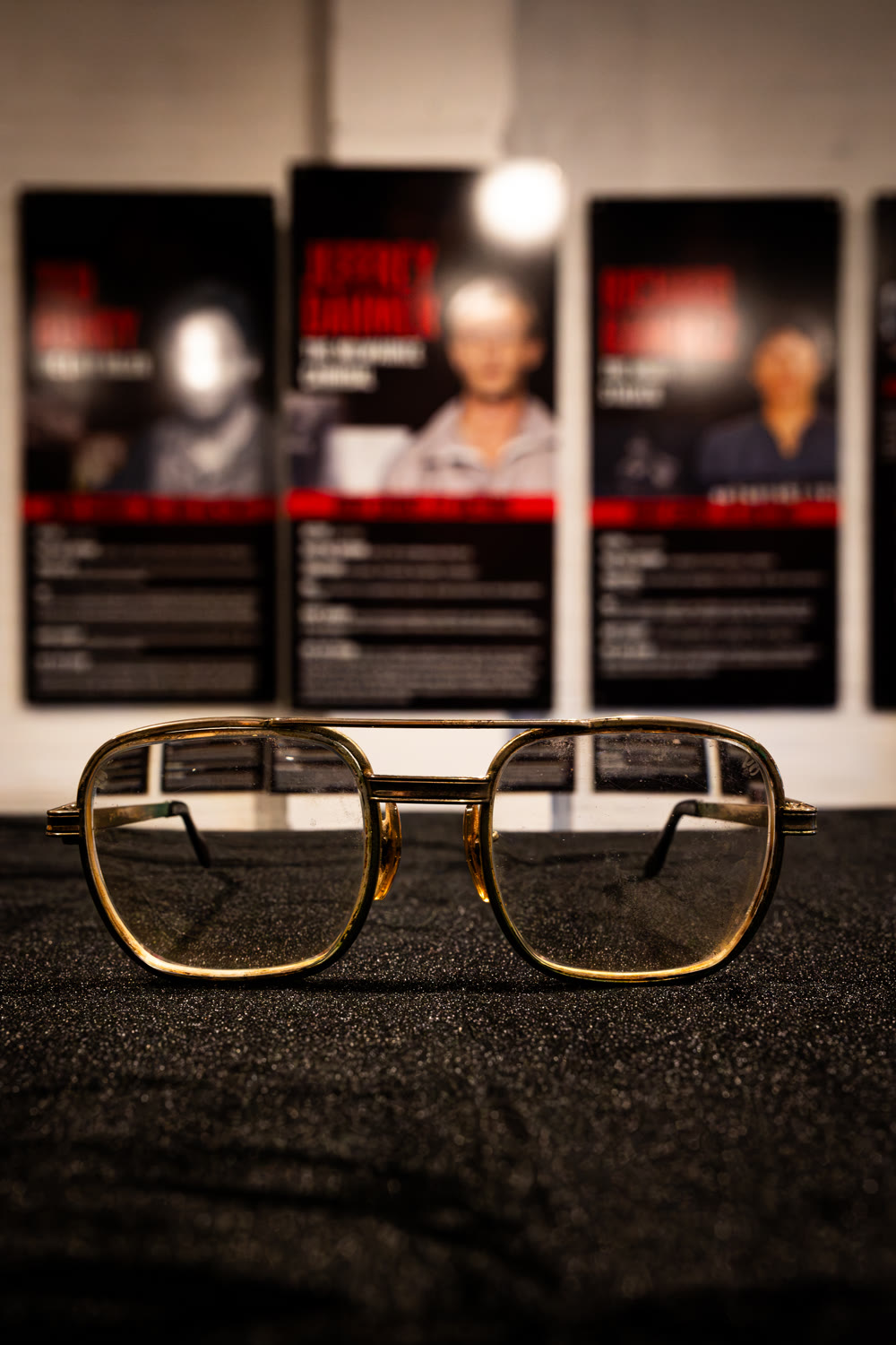 Dahmer's authenticated gold eyeglasses on black velvet
